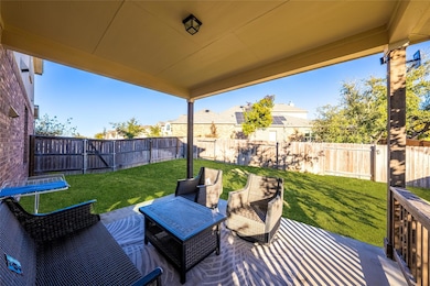 Fenced backyard with a patio