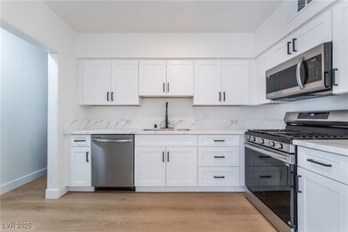 Kitchen with appliances with stainless steel finis