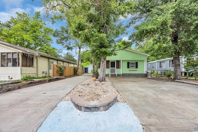 View of front facade with concrete driveway