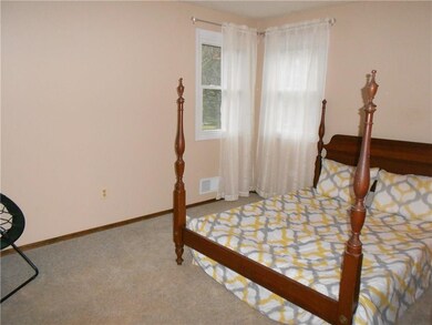 This is the guest bedroom. The corner windows prov