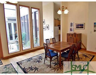 Dining Room. Bamboo Flooring and Open Atrium bring