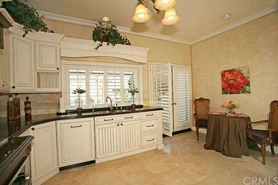 Another View of the Kitchen with Dining Area and F