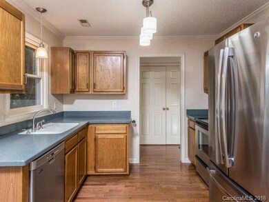 Kitchen, laundry and half bath off living and dini