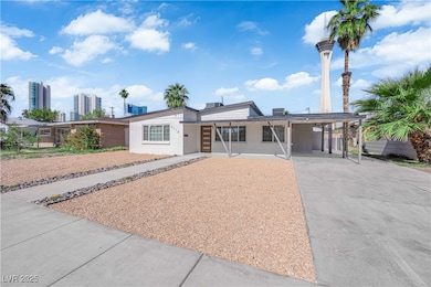 View of front of house featuring concrete driveway