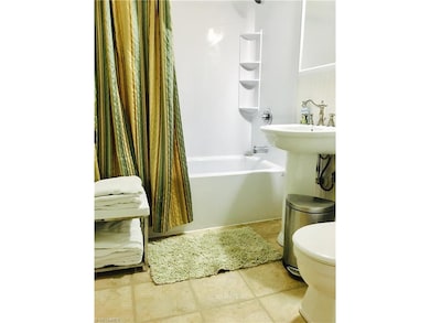 Updated Baths with new tub surrounds in top and bottom units.