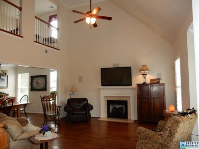 Great Room with vaulted ceiling, two ceiling fans,