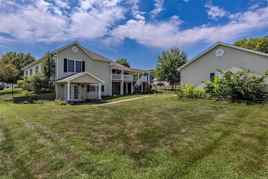 Fenced yard with additional detached garage.