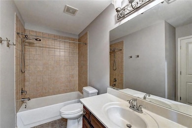 Bathroom with visible vents, tile patterned floors