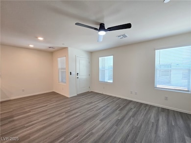 Unfurnished room with dark wood-type flooring, cei