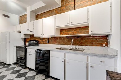View of the kitchen with ample cabinet and counter