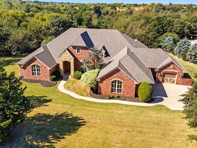 View of front facade with a front lawn and a shingled roof
