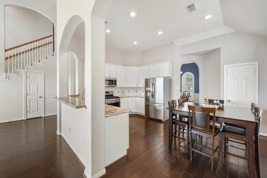 Open floor plan connect the kitchen and living room.  Kitchen and dining room are also connected via arched pass-through, making hosting dinner guests a breeze.