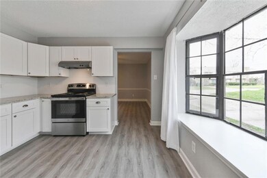 View of kitchen from the back room.