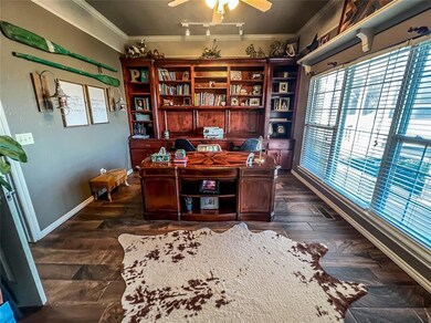 Office space with ceiling fan, dark hardwood / woo