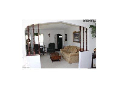 Another view of the living room and front foyer.  