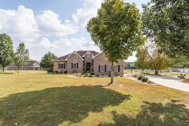 Large front yard with mature trees.