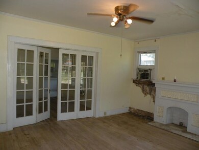 Decorative French doors leading to dining room