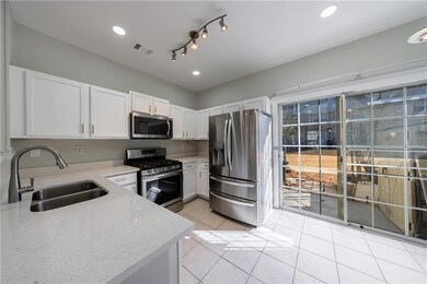 Kitchen featuring visible vents, light stone count