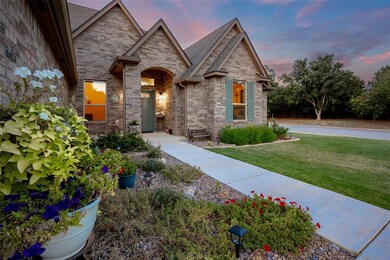 View of front of property featuring brick siding a