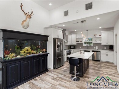 Kitchen with a center island, appliances with stai