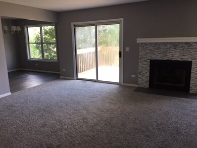 Living room with gas fireplace, newly refaced and 