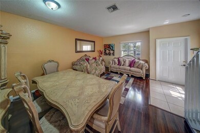 View of living/dining from the kitchen entryway.