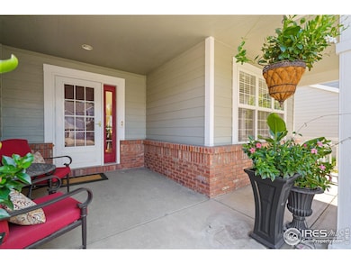 This home is nestled on a park-like lot with an inviting front porch