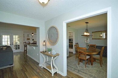 off foyer and leads to kitchen