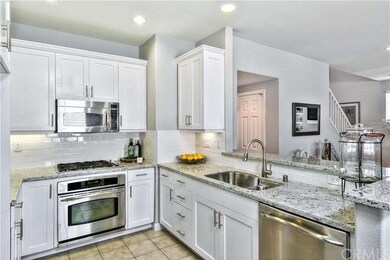 Remodeled kitchen with granite counters and stainl