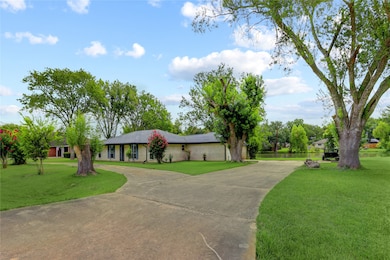 Circle drive and driveway leading to 2 car garage