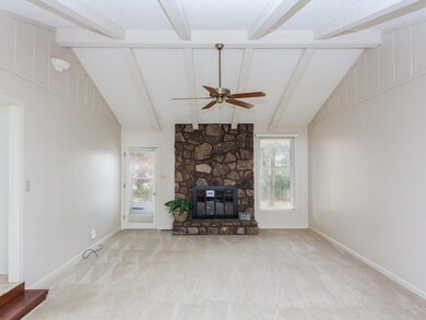 WOW!  That's the only way to describe this AMAZING Great Room which features dramatic beamed ceilings and a striking stone gas fireplace!