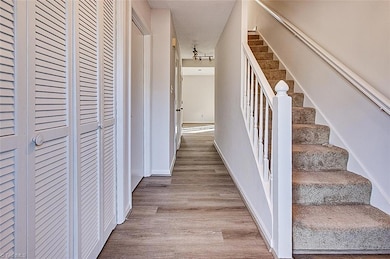 Foyer with brand new engineered laminate flooring and spacious coat closet.