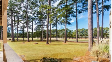 View of community featuring a yard