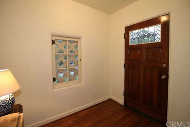 Formal entry with original hardwood floors.