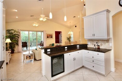 Spacious open kitchen with a wine fridge.