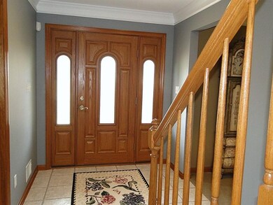 Impressive entry hall, oak woodwork, crown molding