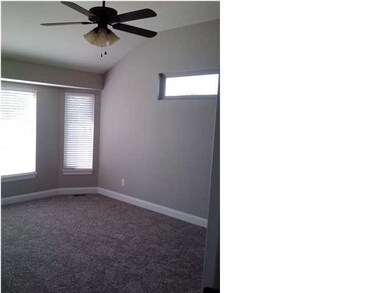 Large master bedroom with bay window and high ceil