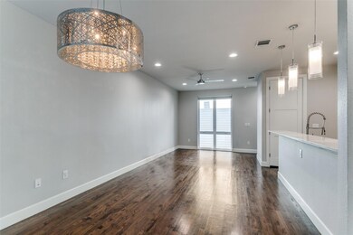Unfurnished living room featuring ceiling fan with