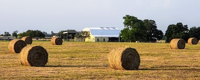 Productive hay fields and a hardworking barn refle
