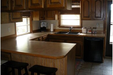 Kitchen. New counter & sink, tile floor, brkfst ba