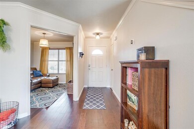 Entry hallway with entrance to bonus room.