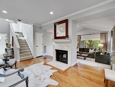 Living room featuring stairs, wood finished floor