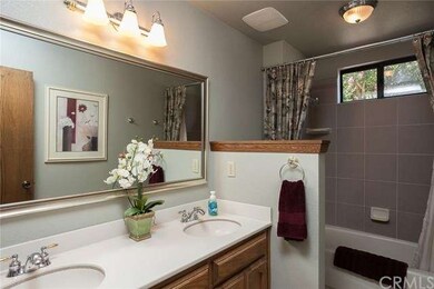Updated hall bathroom with dual sinks, Corian coun