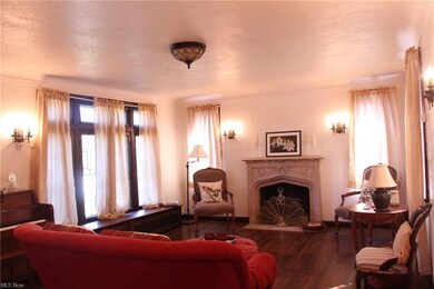Living Room with carved stone fireplace
