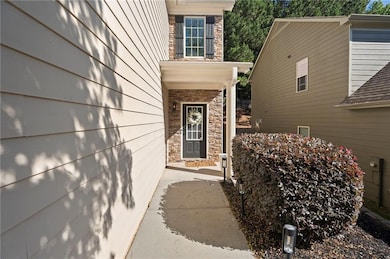 Doorway to property featuring stone siding