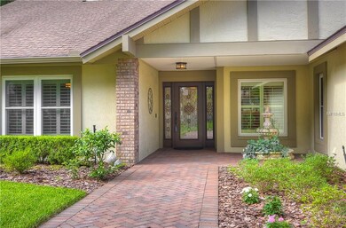 Brick pavers leading  to the gorgeous front door &