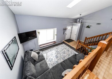 Foyer entrance with lofted ceiling with skylight, 