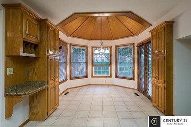 Vaulted ceilings, tons of windows and light, pantry, desk area and door to the back patio.