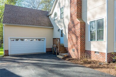 Two car garage with paved double parking spots.  T