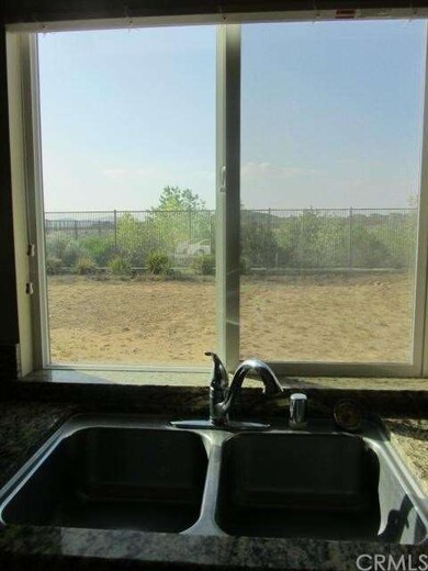 Window over kitchen stainless steel double sink lo
